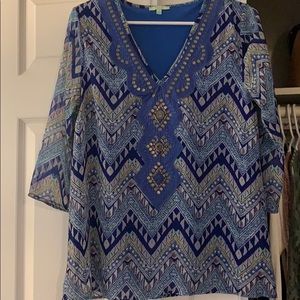 Royal blue blouse with brass detail neckline